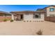 Large backyard featuring desert landscaping, a covered patio, and a block wall at 12125 W Levi Dr, Avondale, AZ 85323