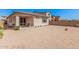 Expansive backyard featuring desert landscaping, a covered patio, and a block wall at 12125 W Levi Dr, Avondale, AZ 85323