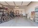 Spacious garage featuring ample storage, tools, and bicycles at 12125 W Levi Dr, Avondale, AZ 85323