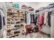 Organized walk-in closet featuring ample shelving, rods, and storage solutions for clothing and shoes at 12125 W Levi Dr, Avondale, AZ 85323