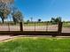 Scenic backyard view with a green lawn and a fence overlooking a golf course at 1335 E June St # 113, Mesa, AZ 85203