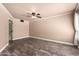 This bedroom offers a blank canvas with wood-look flooring, neutral walls, and a ceiling fan at 13628 N 109Th Ave, Sun City, AZ 85351