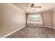 This bedroom offers a blank canvas with wood-look flooring, neutral walls, and a ceiling fan at 13628 N 109Th Ave, Sun City, AZ 85351