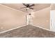 Neutral bedroom featuring ceiling fan, vinyl flooring, storage, and white trim at 13628 N 109Th Ave, Sun City, AZ 85351