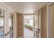 Bright foyer with a decorative tile floor and views to the front yard and the living room beyond at 13628 N 109Th Ave, Sun City, AZ 85351