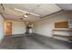 Large garage featuring ample storage space, workbench, and laundry hookups at 13628 N 109Th Ave, Sun City, AZ 85351