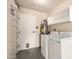 Well-equipped laundry room with washer, dryer, and overhead storage cabinets at 13628 N 109Th Ave, Sun City, AZ 85351