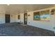 Covered entrance featuring two doors, sidelight, and gray paver flooring at 14027 N 32Nd St, Phoenix, AZ 85032