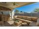 Covered patio with wicker furniture, bar, and ample seating at 14027 N 32Nd St, Phoenix, AZ 85032