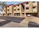 A lovely exterior shot of the condos offering covered parking spaces beneath each unit at 151 E Broadway Rd # 102, Tempe, AZ 85282