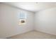 Bright bedroom with neutral carpet, and a window that brings in natural light at 15378 W Cottontail Ln, Surprise, AZ 85387