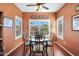 Cozy dining area with large windows providing natural light and neighborhood views at 16017 W Wildflower Dr, Surprise, AZ 85374