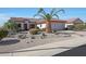 Beautiful single-story home with a landscaped front yard with native plants at 16017 W Wildflower Dr, Surprise, AZ 85374