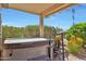 Relaxing covered hot tub with privacy landscaping, a chair and views of the sky at 16017 W Wildflower Dr, Surprise, AZ 85374