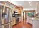 Spacious kitchen featuring stainless steel appliances, granite countertops, and ample cabinet space at 16017 W Wildflower Dr, Surprise, AZ 85374