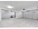 An expansive garage with a clean, open layout, featuring multiple garage doors and ample space at 16749 W Whispering Wind Dr, Surprise, AZ 85387