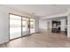 Open concept living area featuring tile floors and sliding glass doors to the outdoor living area at 16749 W Whispering Wind Dr, Surprise, AZ 85387