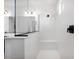 Modern walk-in shower with sleek glass enclosure and rainfall showerhead at 16749 W Whispering Wind Dr, Surprise, AZ 85387