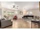 Inviting living room with neutral paint, tile floors, and many windows at 17532 W Caribbean Ln, Surprise, AZ 85388