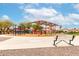 Community playground features a shaded play structure, swings, and seating at 17532 W Caribbean Ln, Surprise, AZ 85388