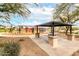 Community playground features a covered picnic area, playground, and landscaping at 17532 W Caribbean Ln, Surprise, AZ 85388