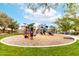 Community playground features colorful play structure, swings, and shade at 17532 W Caribbean Ln, Surprise, AZ 85388