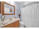 Bathroom featuring a vanity with storage, decorative accents, and a shower with curtain at 18254 N 136Th Ave, Sun City West, AZ 85375