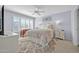 Bright bedroom with plantation shutters, soft carpet, and decorative wall art at 18254 N 136Th Ave, Sun City West, AZ 85375