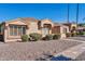 Inviting single-story home with decorative shutters and desert landscaping under a bright blue sky at 18254 N 136Th Ave, Sun City West, AZ 85375