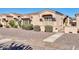 Inviting single-story home with decorative shutters, desert landscaping, and secure gated entry at 18254 N 136Th Ave, Sun City West, AZ 85375