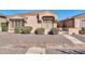 Charming single-story home with decorative shutters, well-kept bushes, and desert landscaping at 18254 N 136Th Ave, Sun City West, AZ 85375