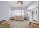 Cozy living room featuring plantation shutters, neutral color palette and comfortable seating at 18254 N 136Th Ave, Sun City West, AZ 85375