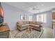 Cozy living room with neutral décor, stylish area rug, and an open layout with plenty of natural light at 18254 N 136Th Ave, Sun City West, AZ 85375