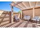 Inviting outdoor patio with comfortable seating, a pergola, and a brick-paved area at 18254 N 136Th Ave, Sun City West, AZ 85375