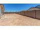 Open backyard featuring a block wall surround for privacy and security at 18347 W Monte Lindo Ln, Surprise, AZ 85387