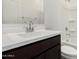 Bathroom featuring a dark vanity, framed mirror and a white bath/shower combo at 18347 W Monte Lindo Ln, Surprise, AZ 85387