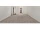 Empty bedroom showcasing new carpets, open space and neutral walls at 18347 W Monte Lindo Ln, Surprise, AZ 85387
