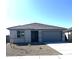 Charming single-story home featuring a gray color scheme, concrete driveway, and low maintenance landscaping at 18347 W Monte Lindo Ln, Surprise, AZ 85387