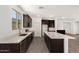 Modern kitchen showcasing ample counter space, stainless appliances, and sleek dark cabinetry at 18347 W Monte Lindo Ln, Surprise, AZ 85387