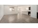 Open-concept living space featuring tile floors, recessed lighting, and natural light at 18347 W Monte Lindo Ln, Surprise, AZ 85387