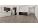 Open floor plan featuring tile floors, recessed lighting, and dark wood cabinets at 18347 W Monte Lindo Ln, Surprise, AZ 85387