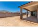 Backyard features a covered patio area and block fence at 18363 W Monte Lindo Ln, Surprise, AZ 85387