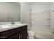 Modern bathroom featuring vanity with chrome faucet and shower and tub combination at 18363 W Monte Lindo Ln, Surprise, AZ 85387