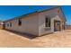 Exterior view of home side yard and covered patio at 18363 W Monte Lindo Ln, Surprise, AZ 85387