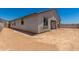 Exterior view of home side yard and covered patio at 18363 W Monte Lindo Ln, Surprise, AZ 85387