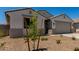 Eye-catching single-story home offers desert landscaping and an attached two-car garage at 18363 W Monte Lindo Ln, Surprise, AZ 85387