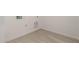 Neutral laundry room with tile flooring and modern washer/dryer hookups at 18363 W Monte Lindo Ln, Surprise, AZ 85387