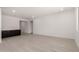 Open concept living room featuring dark cabinets and hard surface floors at 18363 W Monte Lindo Ln, Surprise, AZ 85387