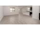Bright, open concept living room with hard surface floors and recessed lighting at 18363 W Monte Lindo Ln, Surprise, AZ 85387