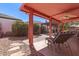 Inviting back patio featuring tile flooring, lounge chairs, and a covered seating area for outdoor relaxation at 2101 S Meridian Rd # 60, Apache Junction, AZ 85120